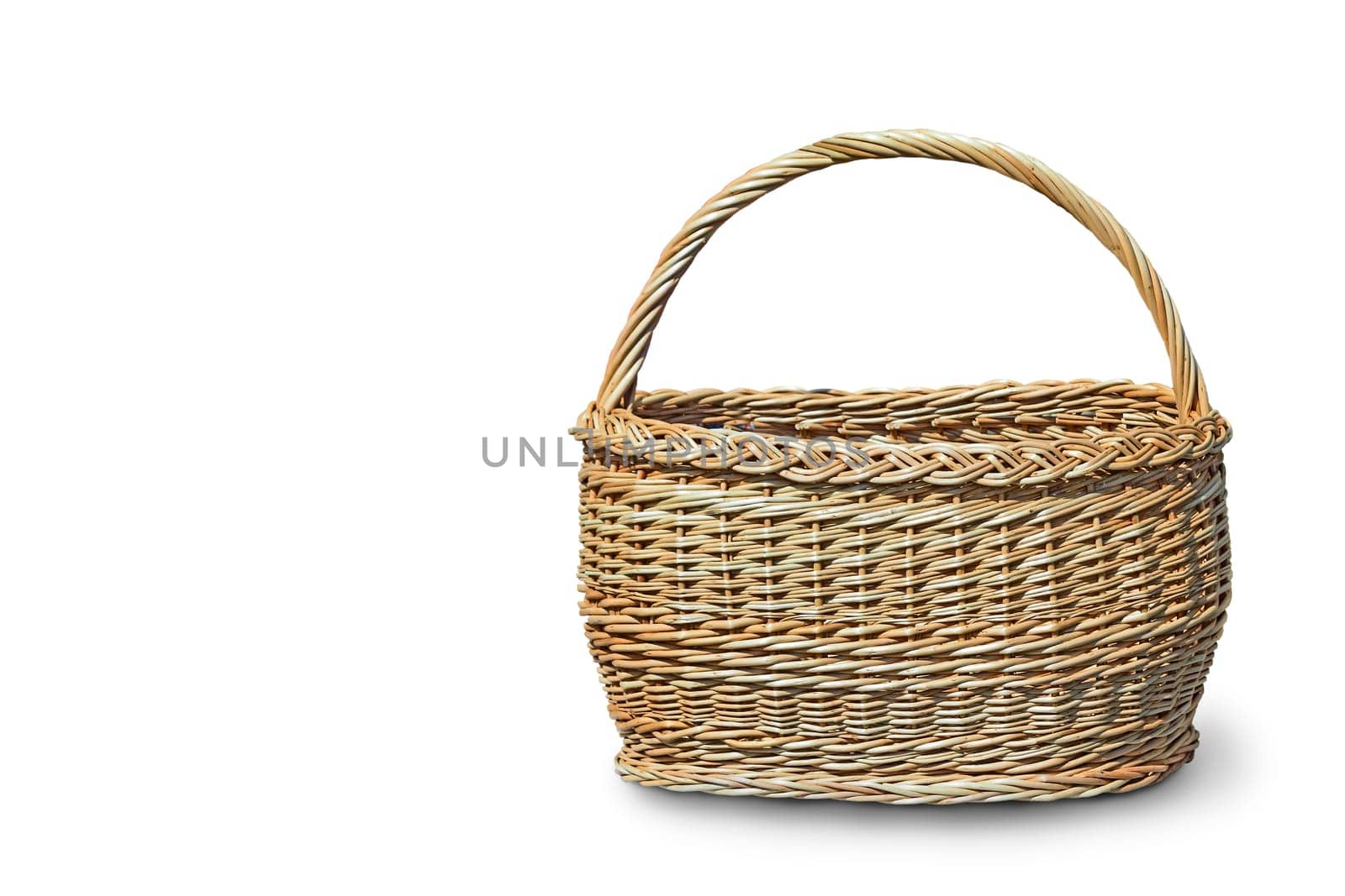 Spacious wicker basket with handle. Presented on a white background.