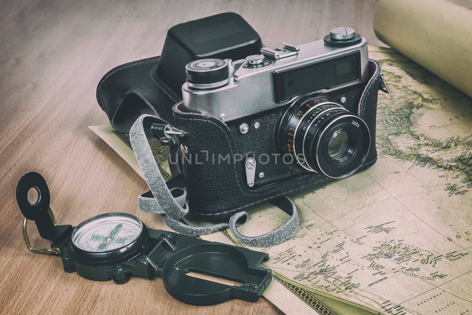 Items needed for travel: a large backpack, compass, camera, map of the world. Vintage items in retro style
