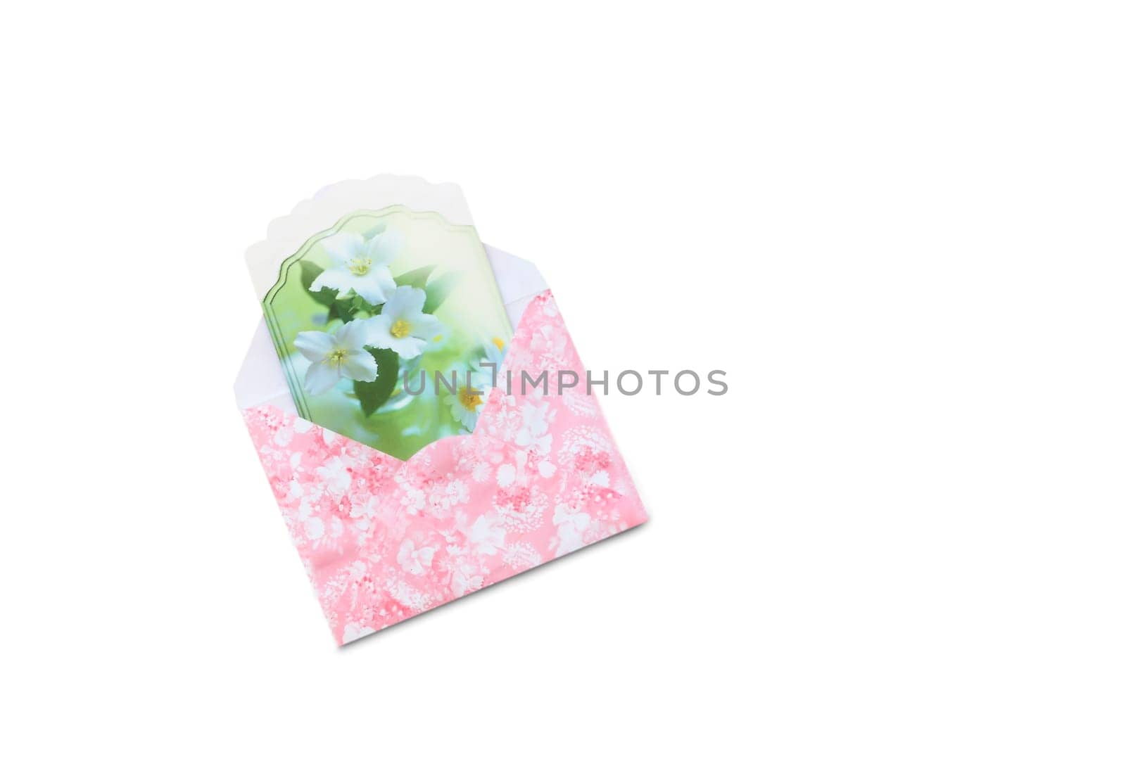 In a beautiful envelope with a pink pattern is a greeting card. Presented on a white background.