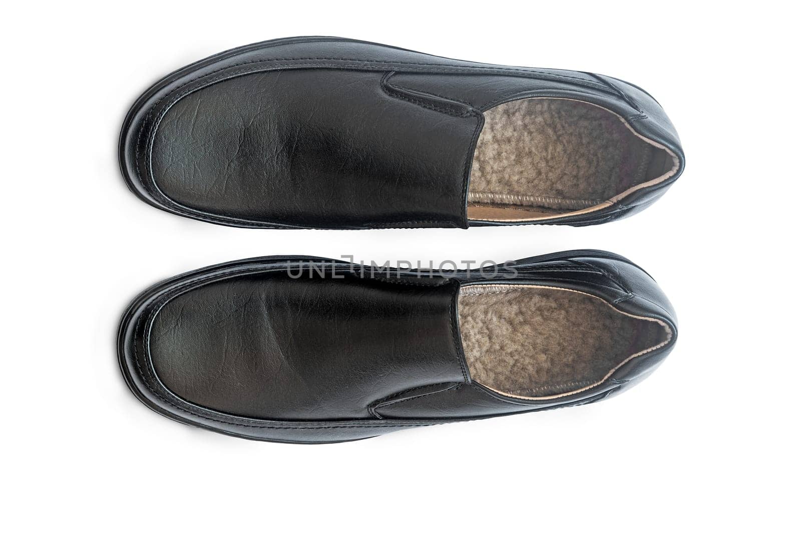 Convenient man's shoes from a genuine leather of black color. Are presented on a white background.