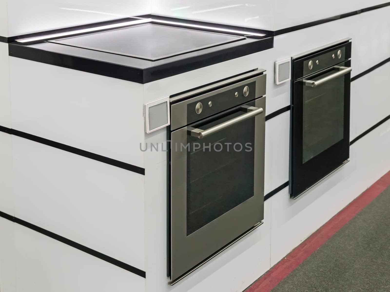 In the store on display demonstrates modern electric oven.