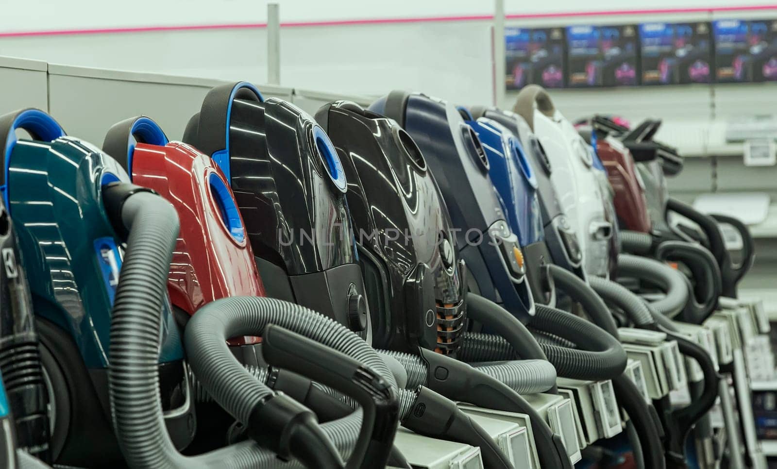 Appliances store presents for sale modern vacuum cleaners from different manufacturers..