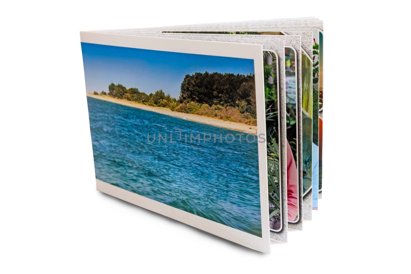 Photo album made in the form of a beautiful photobook. Presented on a white background.