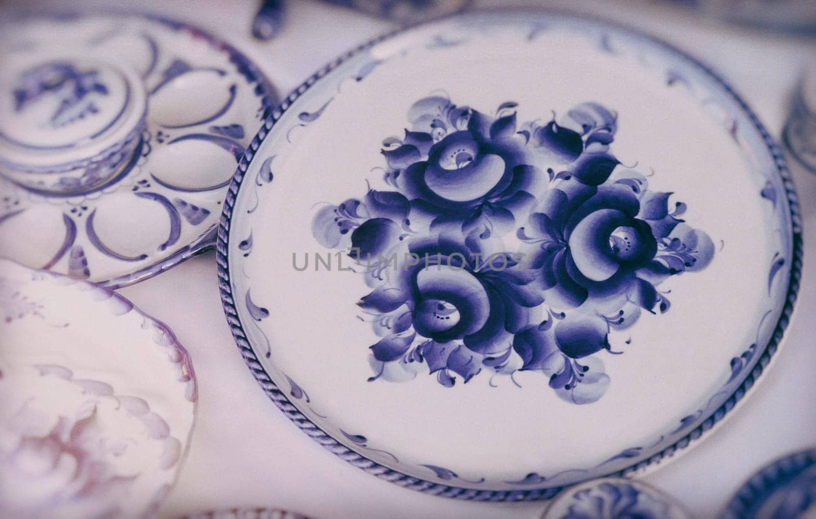 Beautiful large platter, and other dishes with the blue pattern in the style of Gzhel .