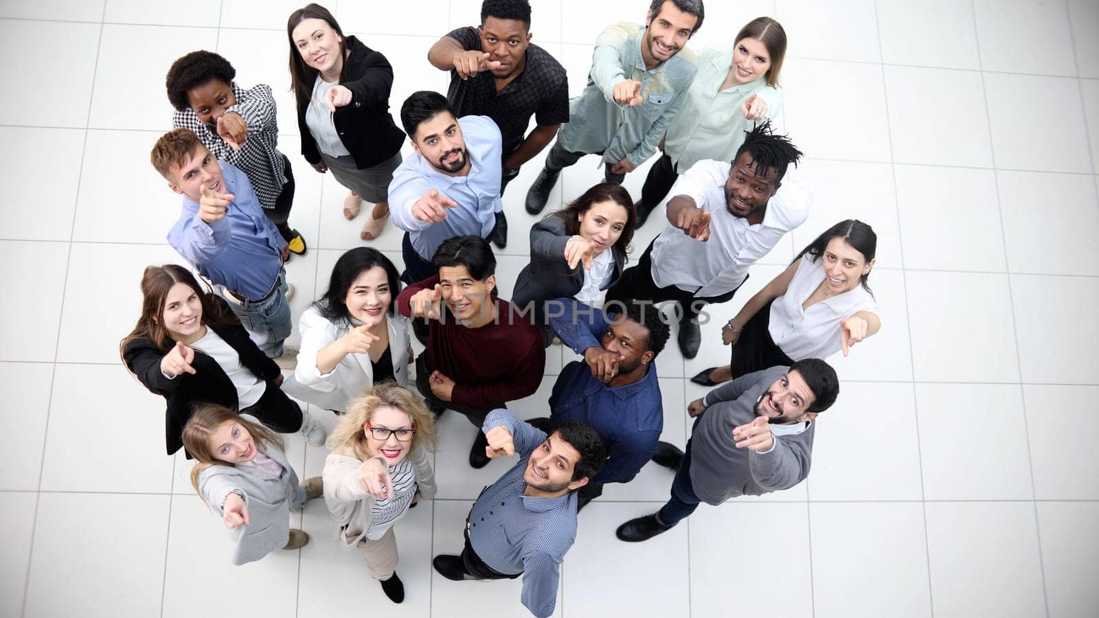 large group of diverse young people looking up hopefully