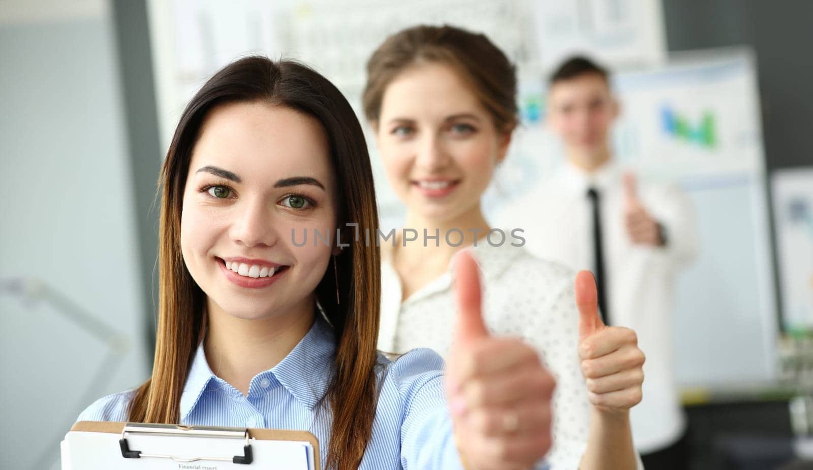 Portrait of pretty female showing approving gesture to greet colleague or boss with great joy and calmness. Beautiful lady work with friendly colleagues. Company meeting concept