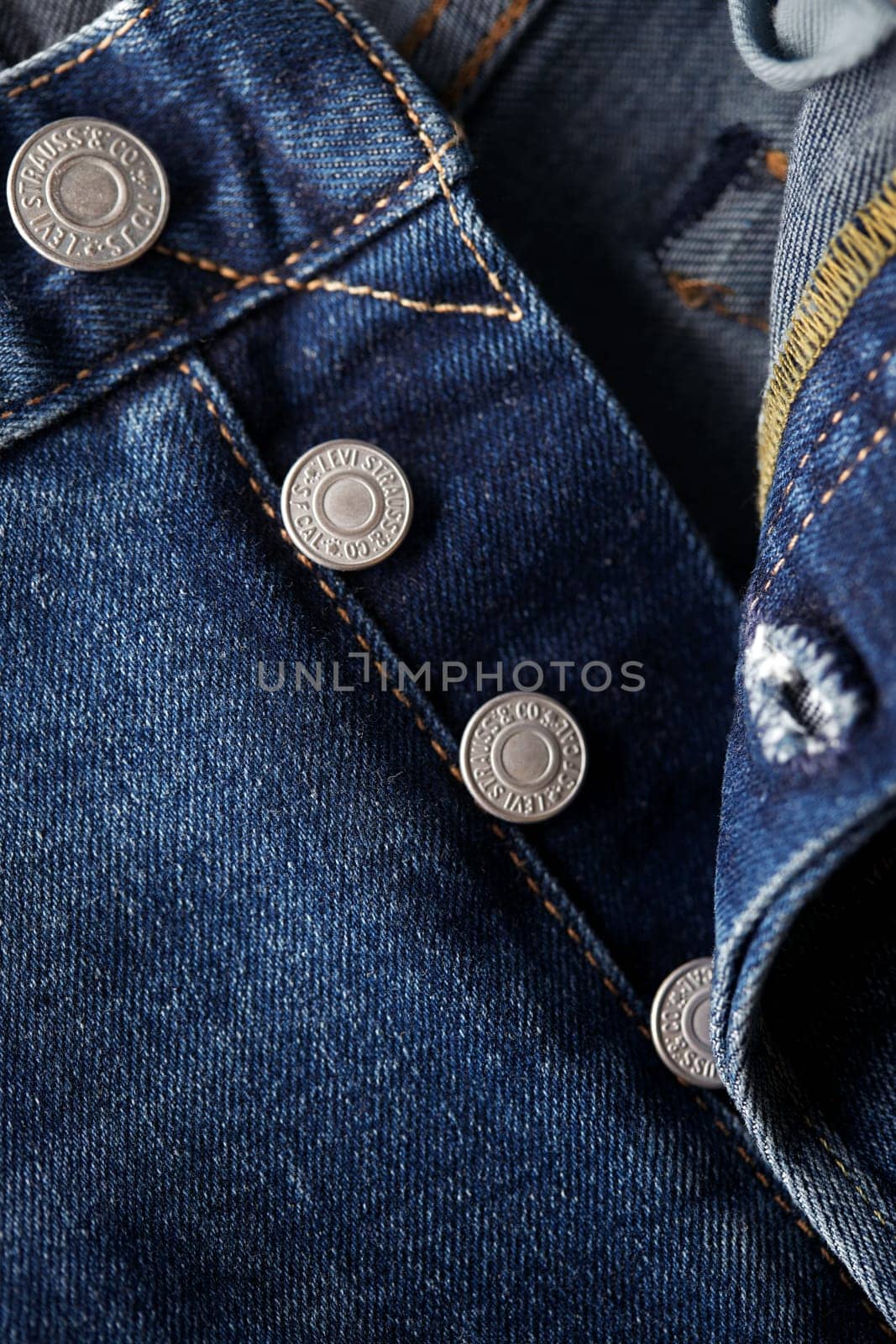 Close up of the details of new LEVI'S 501 Jeans. Seams and button fly close-up. Classic jeans model. LEVI'S is a brand name of Levi Strauss and Co, founded in 1853. 31.12.2021, Rostov, Russia by EvgeniyQW
