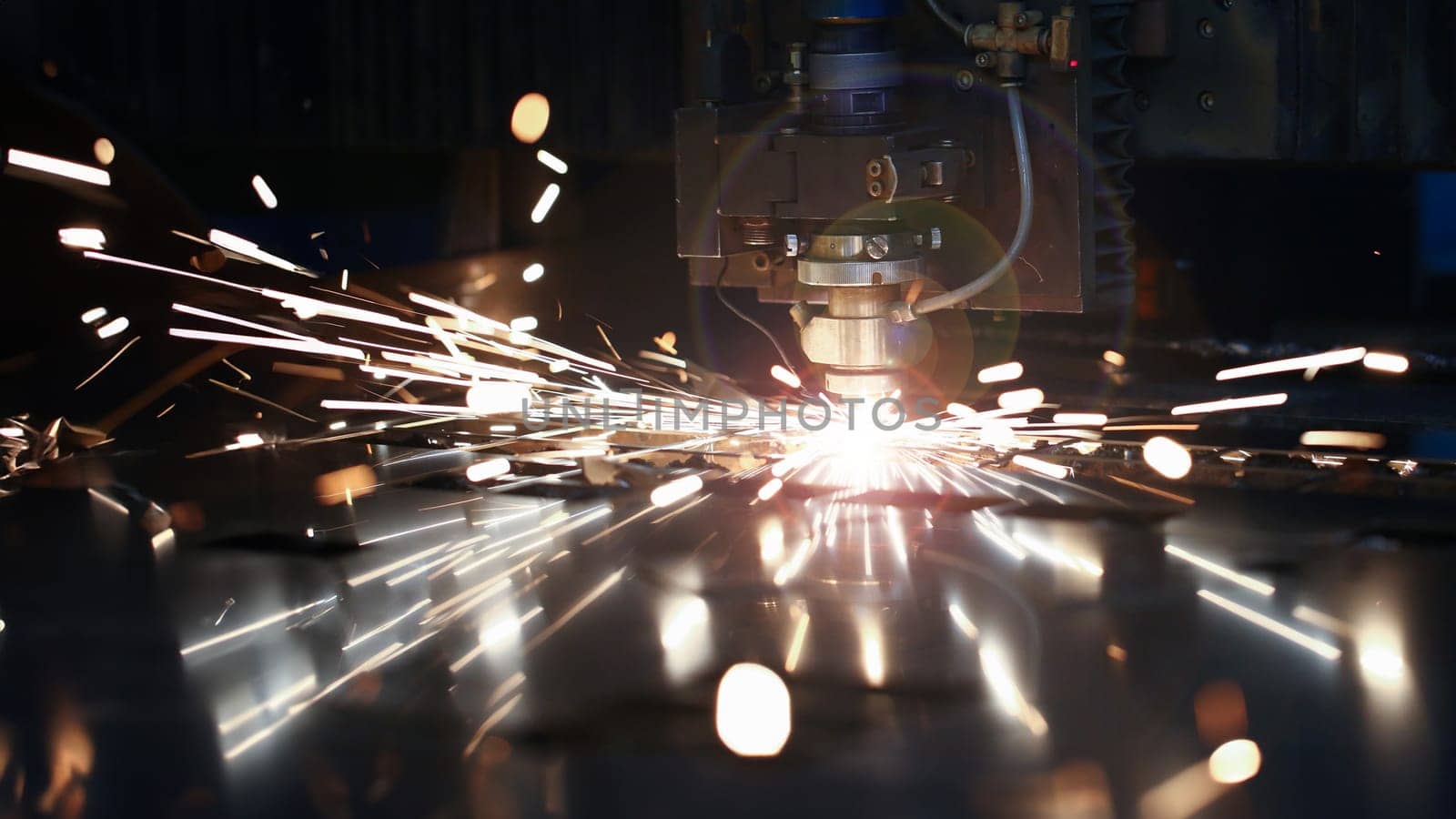 Laser metall cut cnc machine. Fly fire sparks background. Industrial processing concept