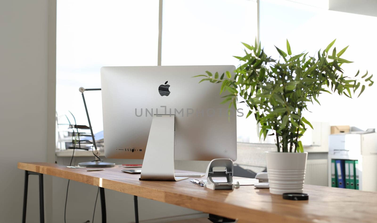 Minsk, Belarus - 25 September 2019: Modern pc apple imac on office table. Illusttative editorial.