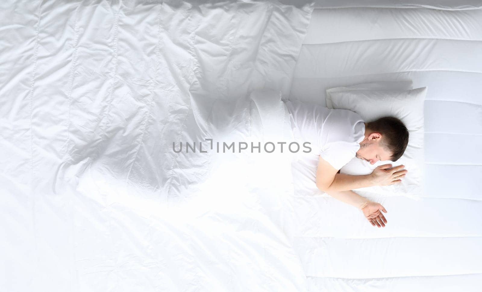 Young caucasian beauty woman sleeping on white bed by kuprevich