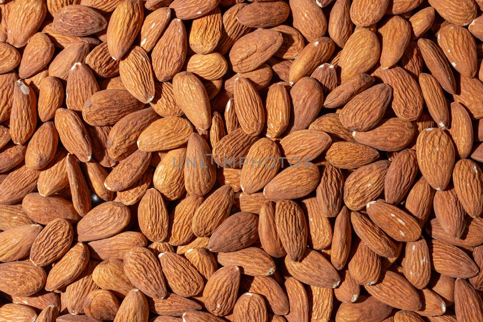 Scattered Almonds. Background from Almond Nuts. Natural High-Calorie Snacks
