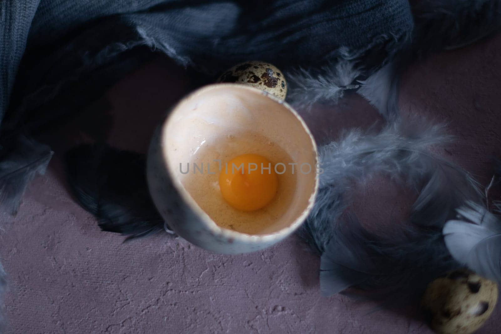 quail eggs in ceramic vases, gray feathers on the table, Easter still life with dietary eggs, diet and antioxidants, dark key and shallow depth of field, high quality photo