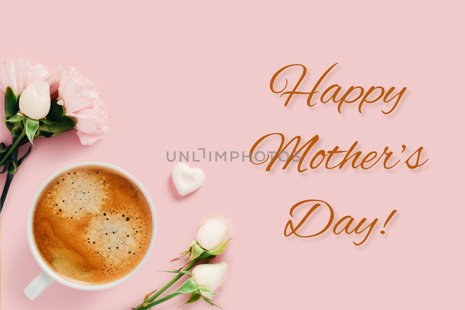 Happy Mother's Day card. Tasty coffee surranuded by white roses and one peace of sugar on pink background.