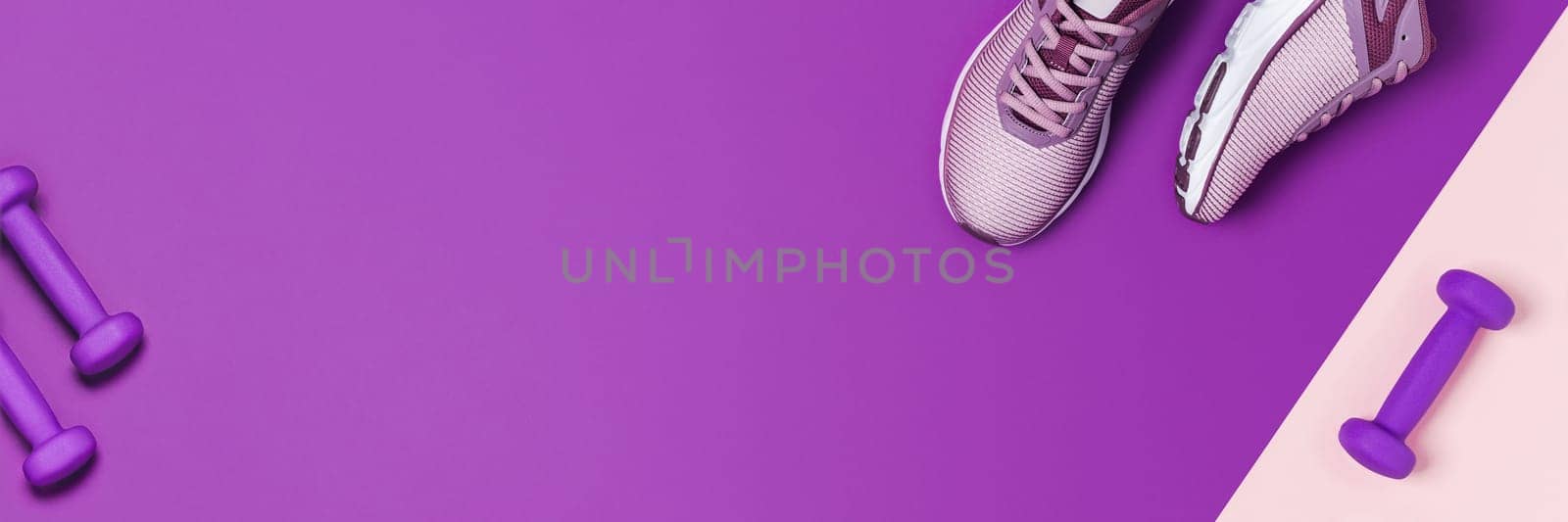 Train at home in a calm environment. Purple background with sneakers and dumbbells.