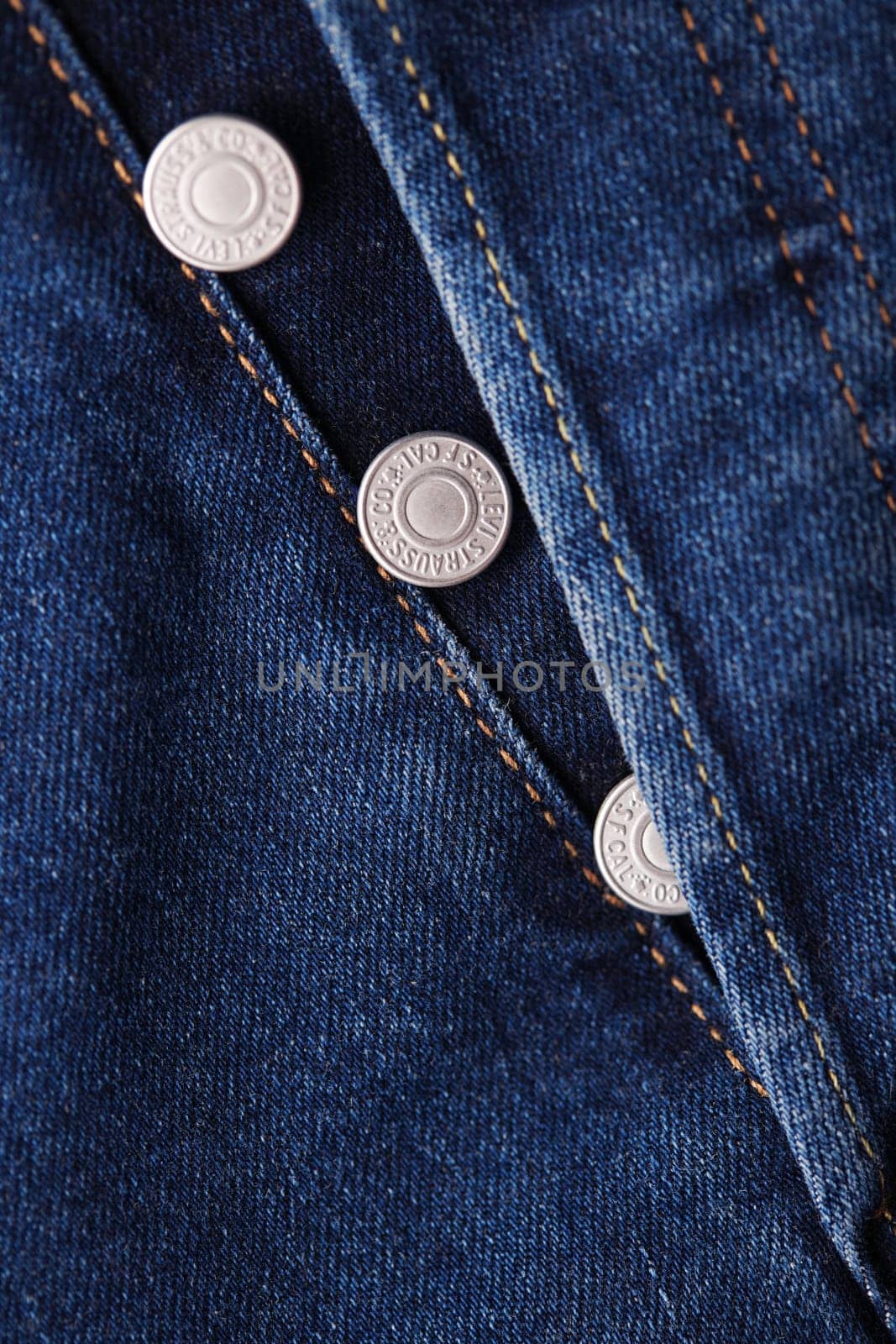 Close up of the details of new LEVI'S 501 Jeans. Seams and button fly close-up. Classic jeans model. LEVI'S is a brand name of Levi Strauss and Co, founded in 1853. 31.12.2021, Rostov, Russia by EvgeniyQW