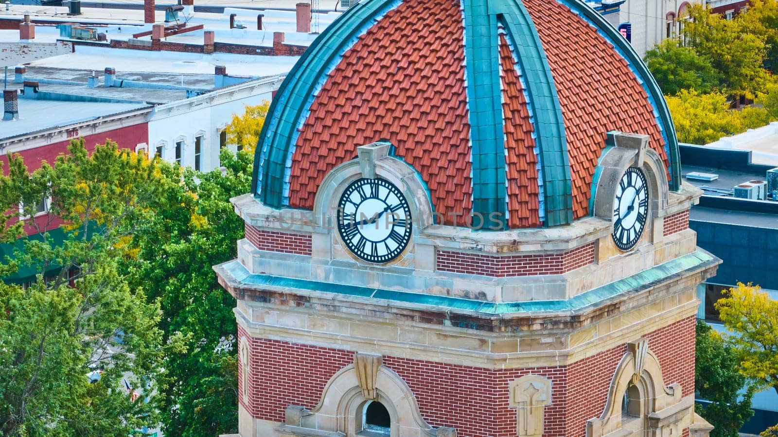 Historic Elkhart County Courthouse clock tower with vibrant dome in downtown Goshen, Indiana, captured from an aerial perspective