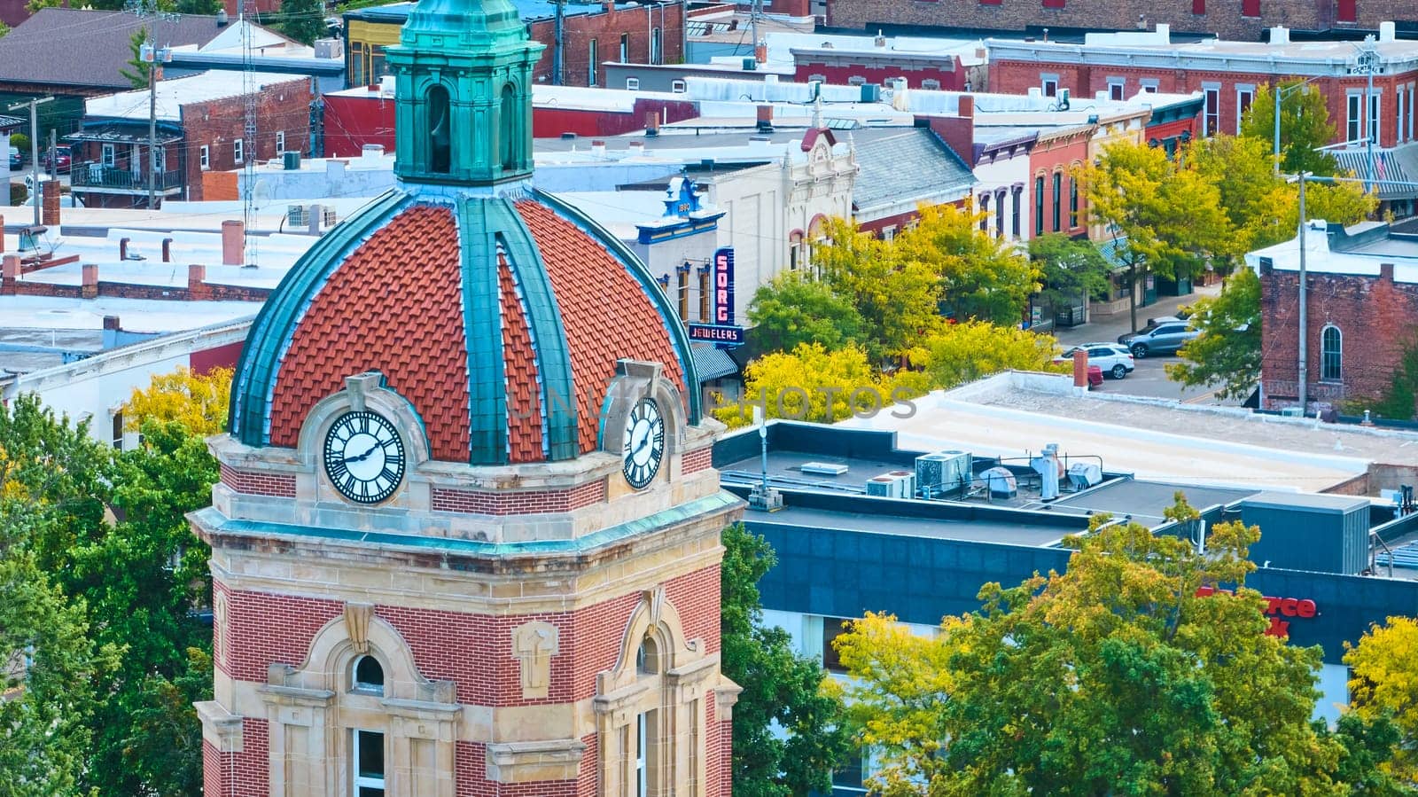 Autumn view of historic Elkhart County Courthouse with red-tiled dome in downtown Goshen, Indiana, captured from an elevated perspective using DJI Mavic 3 drone