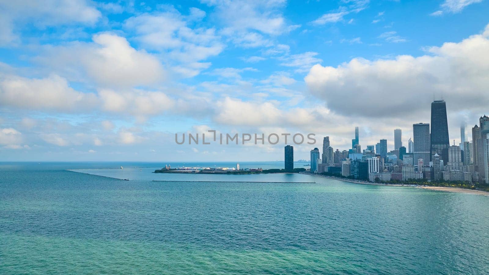 Image of Pretty Lake Michigan aerial with downtown Chicago skyscrapers along coast on summer day, tourism