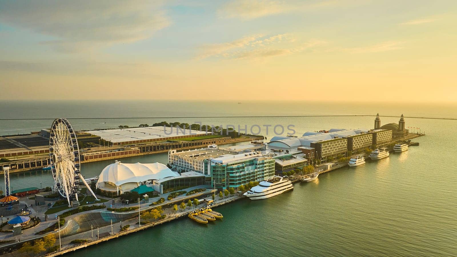 Image of Navy Pier on Lake Michigan at sunrise with aerial of Centennial Wheel at dawn, Chicago, IL