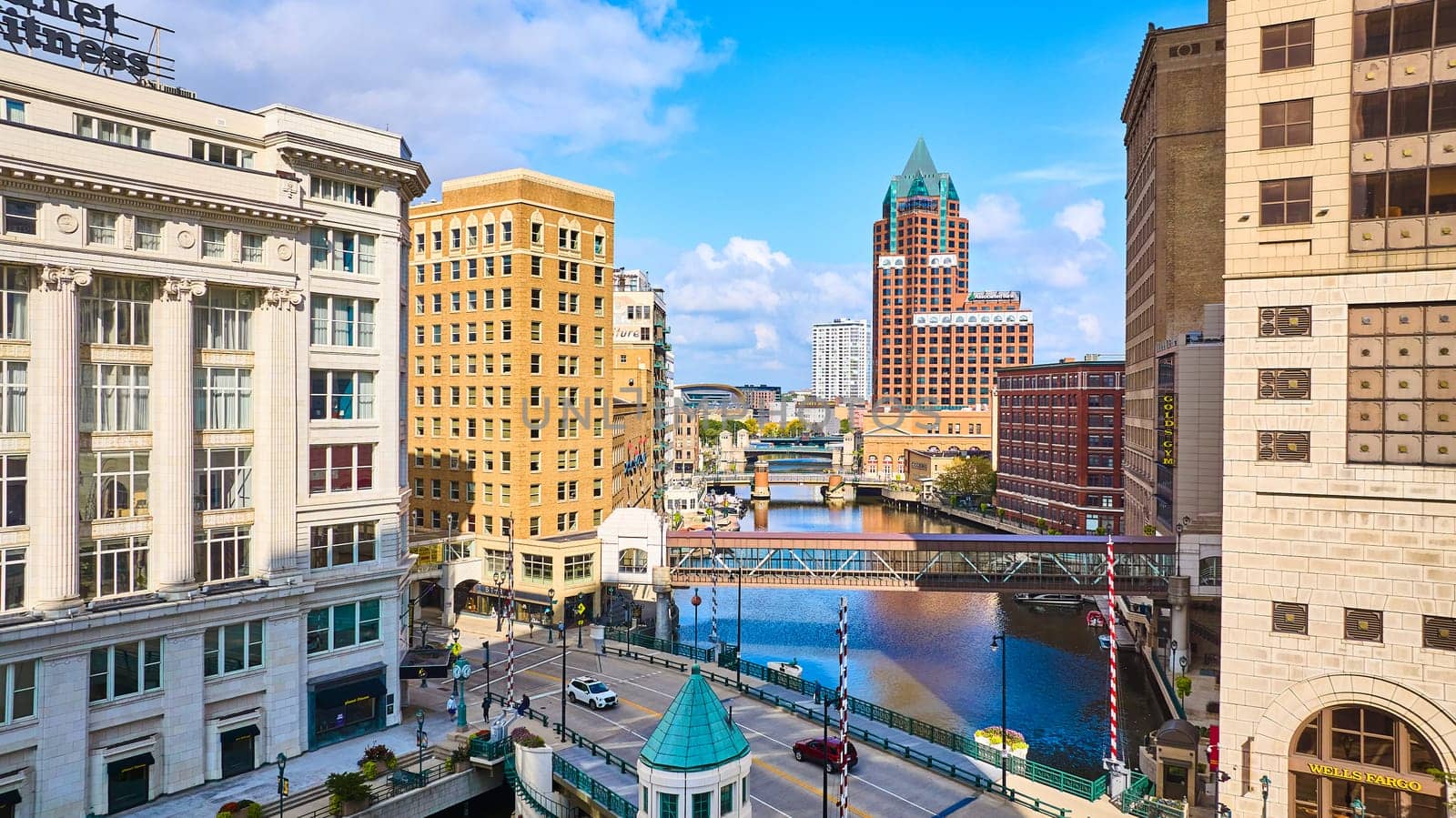 Daytime Aerial View of Diverse Architecture and Canal in Bustling Downtown Milwaukee, Captured by DJI Mavic 3 Drone