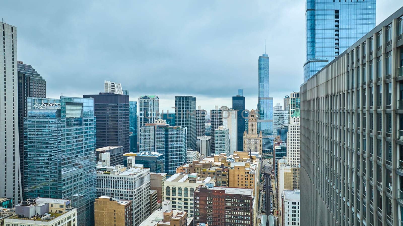 Image of Downtown skyscraper building aerial with tourism travel through big city, Chicago Illinois, daytime