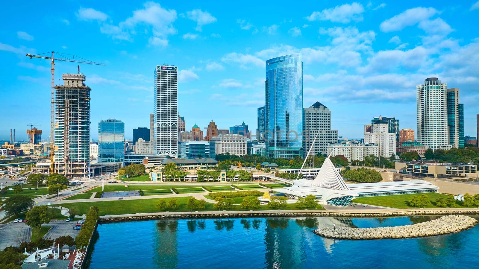Aerial View of Milwaukee's Expansive Cityscape with Vibrant Lake Michigan Shoreline, Quadracci Pavilion Art Museum and New Skyscraper Construction, 2023