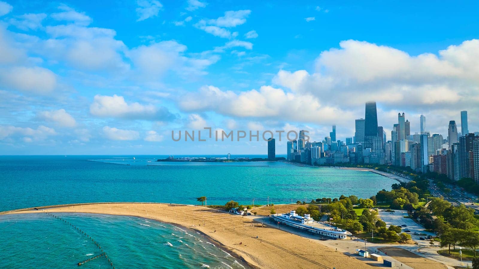 Image of Sandy beach with tourism travel along Lake Michigan with downtown Chicago on sunny summer day