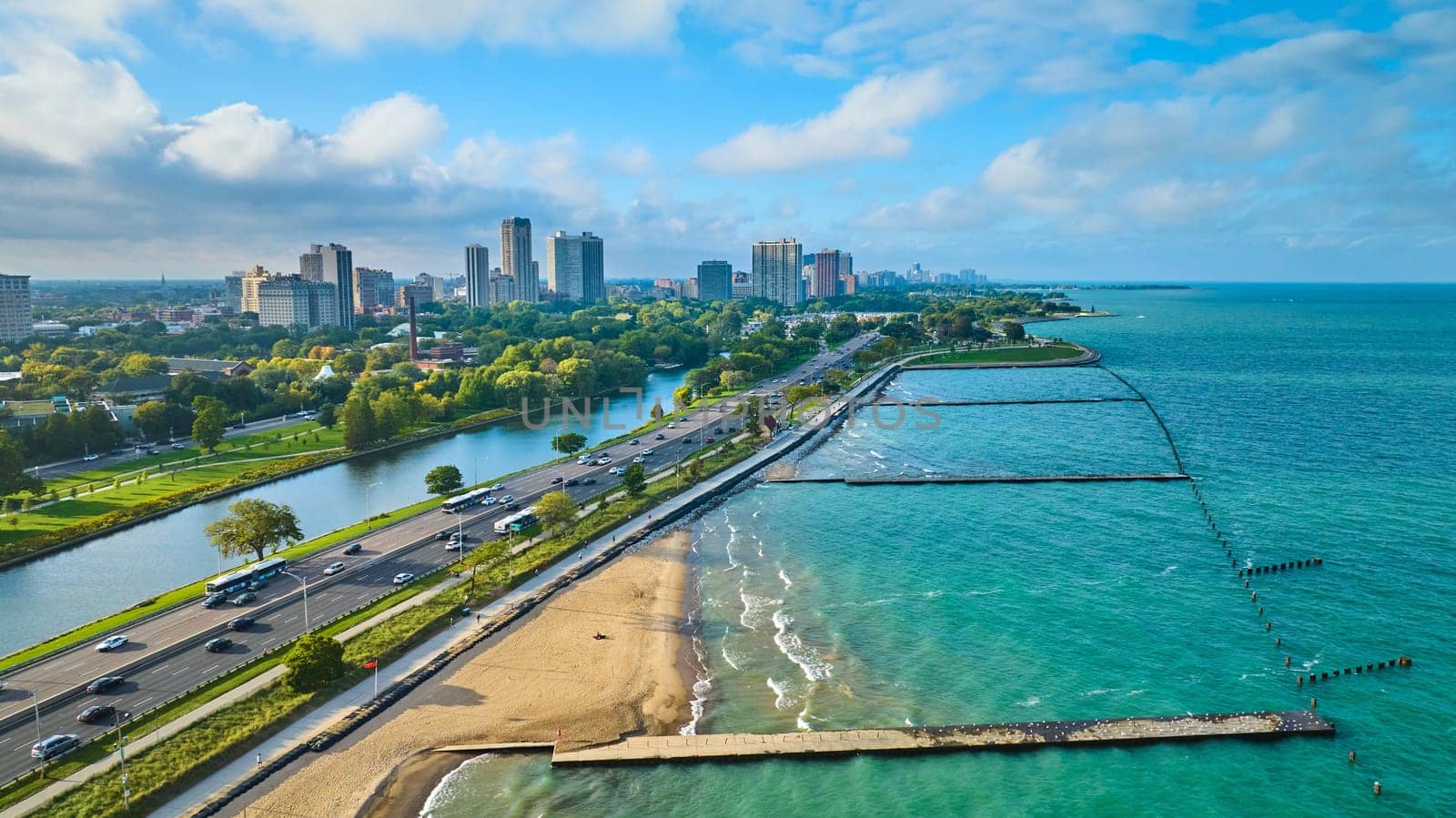 Image of Tourism sandy beach along coast for Chicago travel aerial beside Lake Michigan on summer day