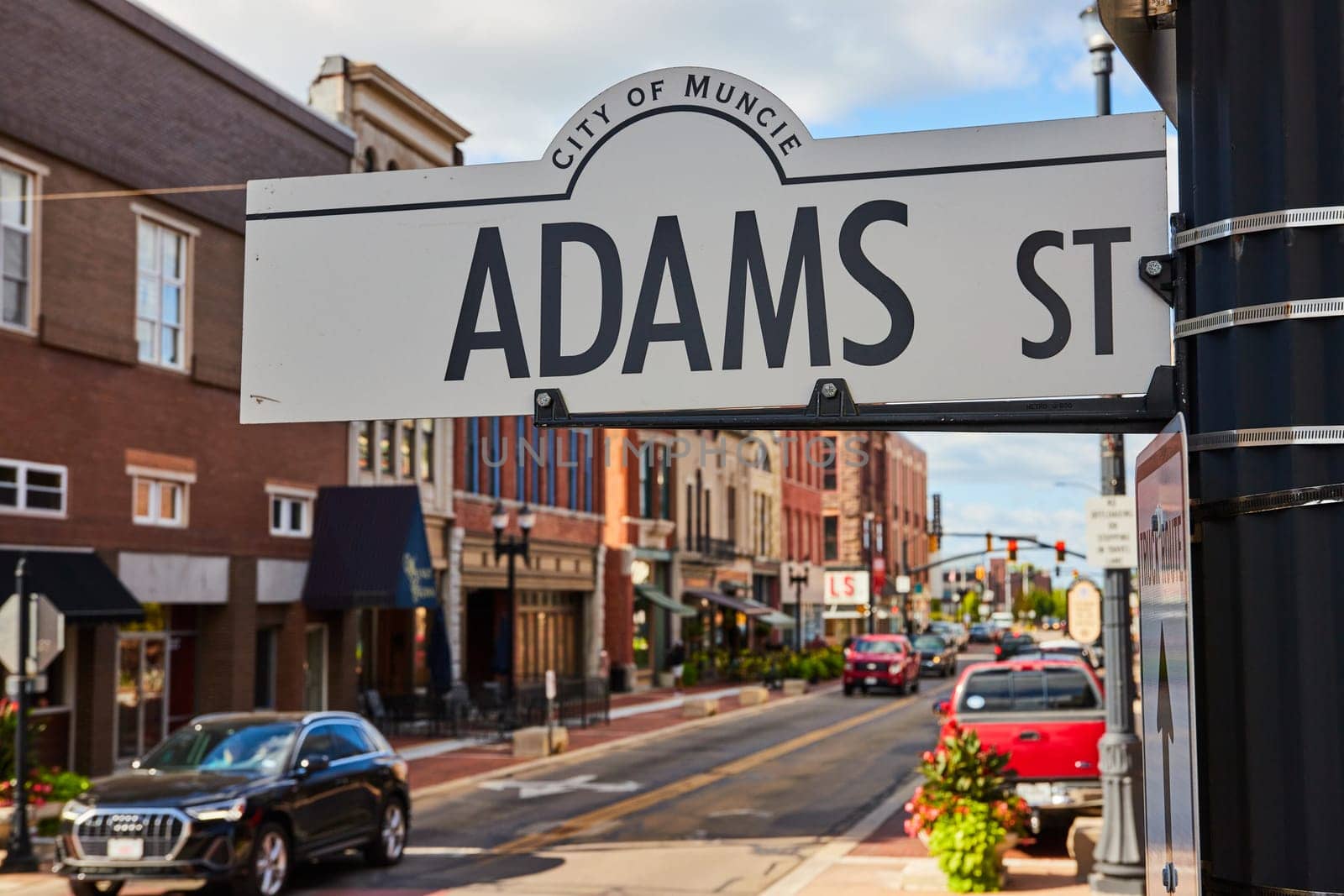 Adams Street Sign with Downtown Muncie Scene by njproductions
