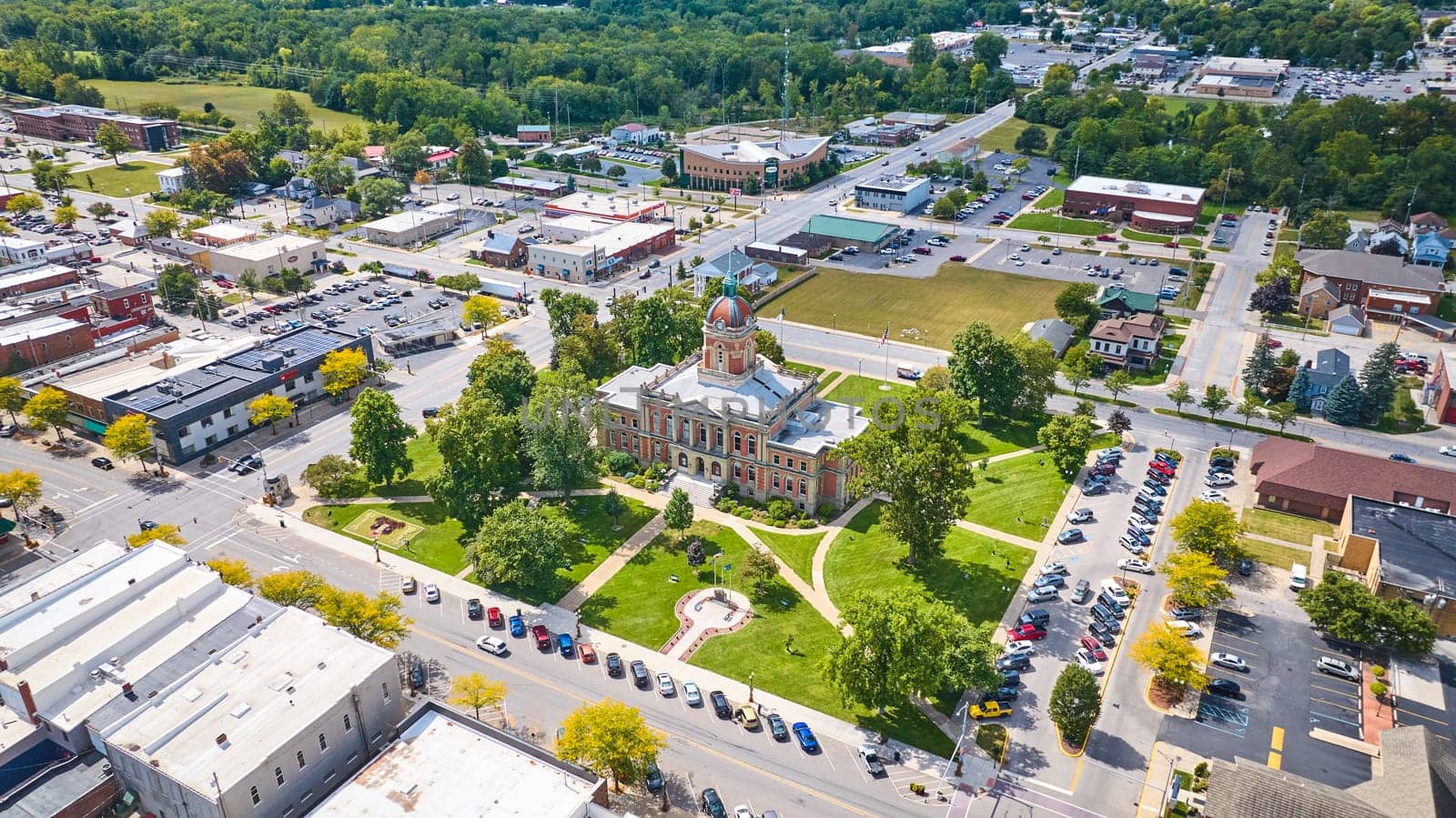 Aerial View of Elkhart Courthouse Amidst Small Town Greenery by njproductions