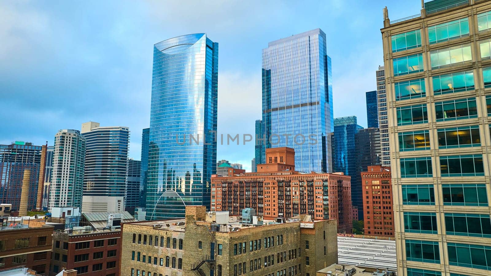 Image of Downtown skyscraper buildings Chicago aerial on sunny and overcast day, tourism