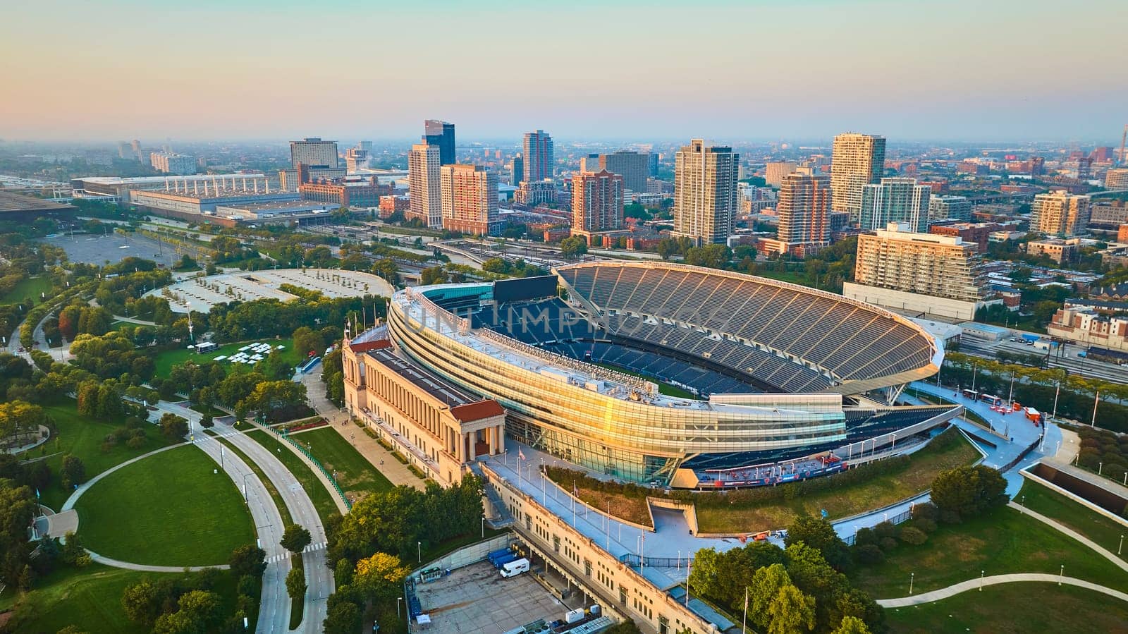Image of Aerial Soldier Field Chicago football sports stadium at sunrise, Illinois in summer