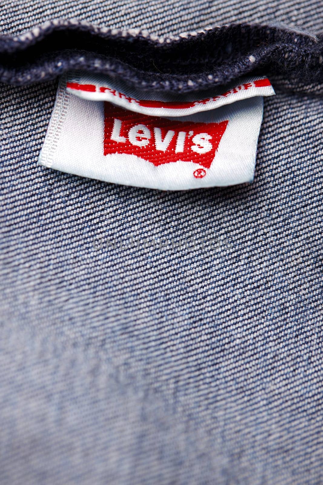 Close up of the of the label of new LEVI'S 501 Jeans on the inside. Logo and stamp LEVI'S on the underside of the textile. Classic jeans model Levi Strauss. 31.12.2021, Rostov, Russia by EvgeniyQW