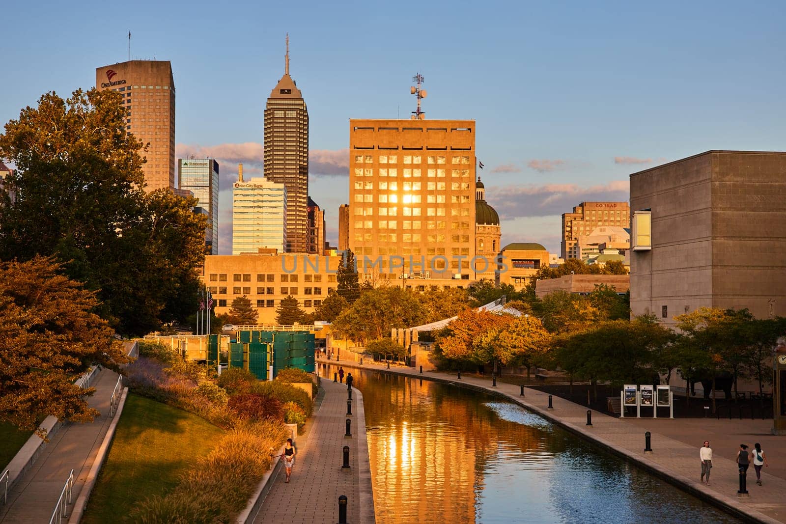 Golden Sunset over Indianapolis Skyline, Reflective Modern Buildings and Bustling Canals, 2023