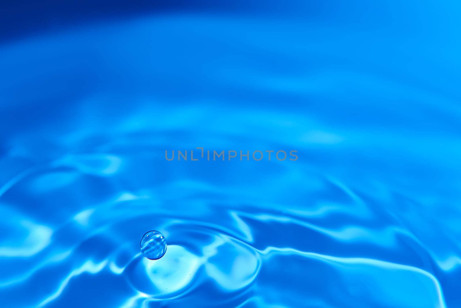 096.One or more drops of water splashing into waves and undefined shapes. Wallpaper by raul_ruiz