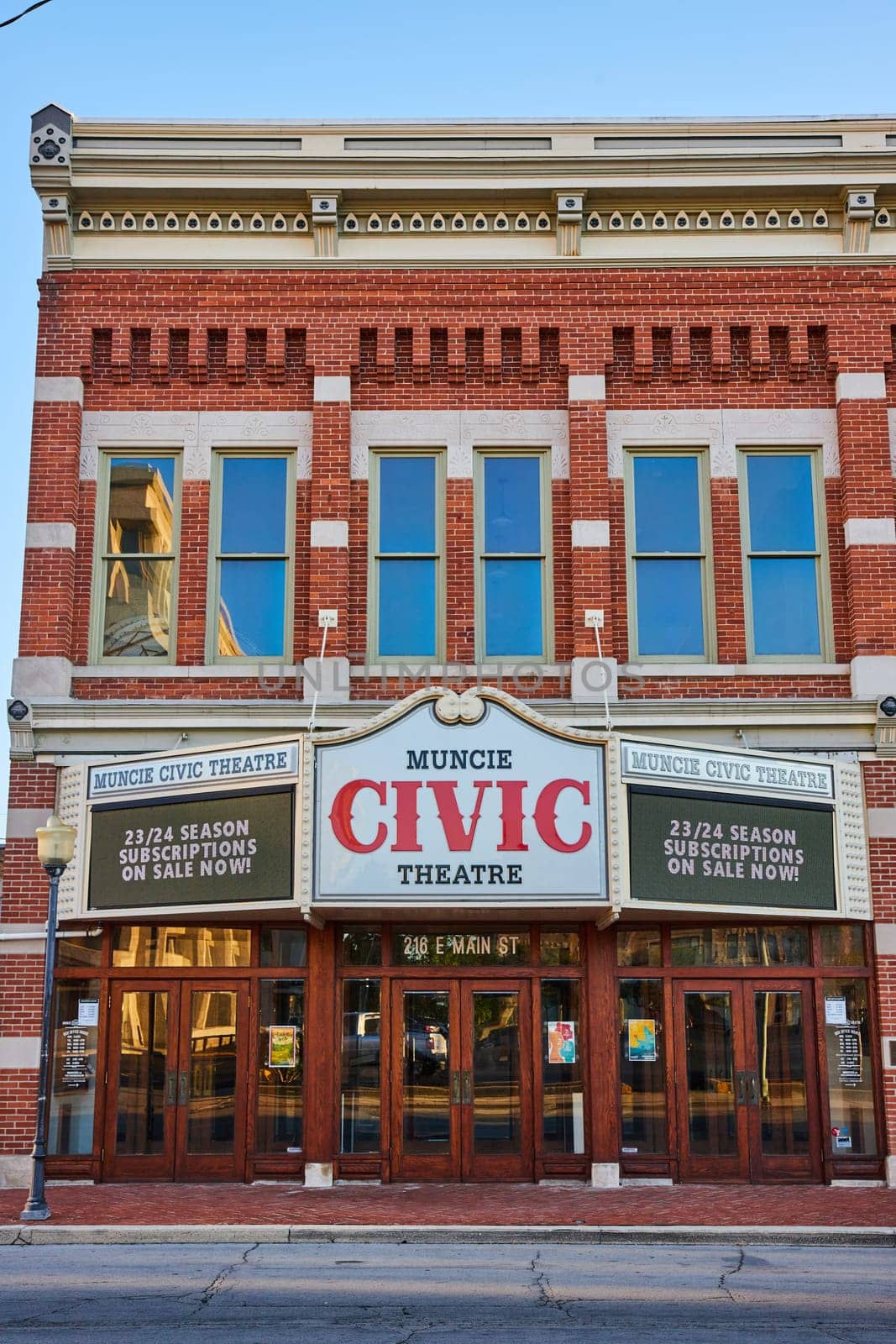 Historic Muncie Civic Theatre in downtown Indiana during late afternoon, showcasing classic American architecture and promoting the upcoming 23 24 Season.