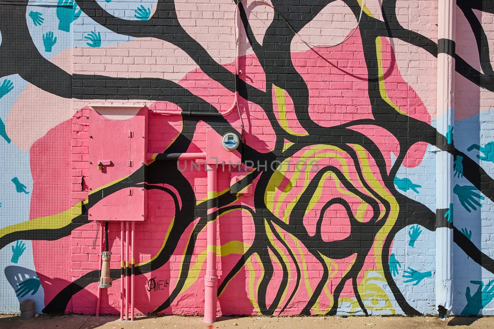 Colorful Abstract Urban Mural with Handprints on Brick Wall by njproductions