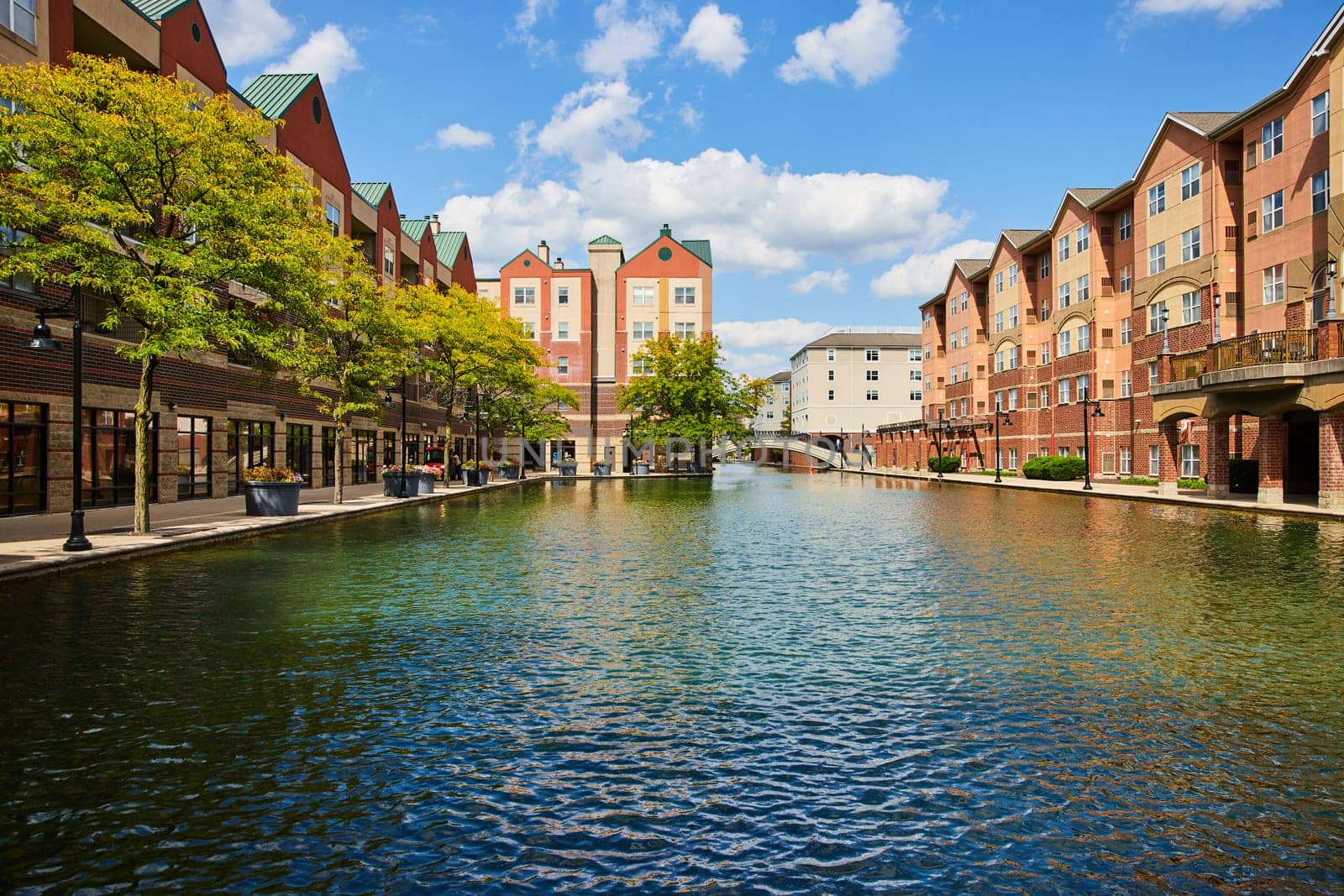 Autumn Daytime View of Vibrant Commercial and Residential Buildings along an Urban Canal in Indianapolis, 2023