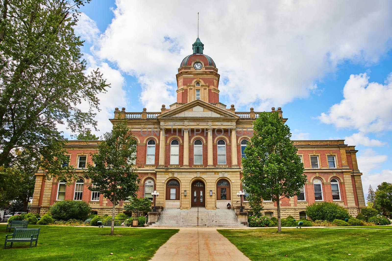Image of Elkhart County courthouse on bright summer day with cloudy blue sky, law and order, Indiana