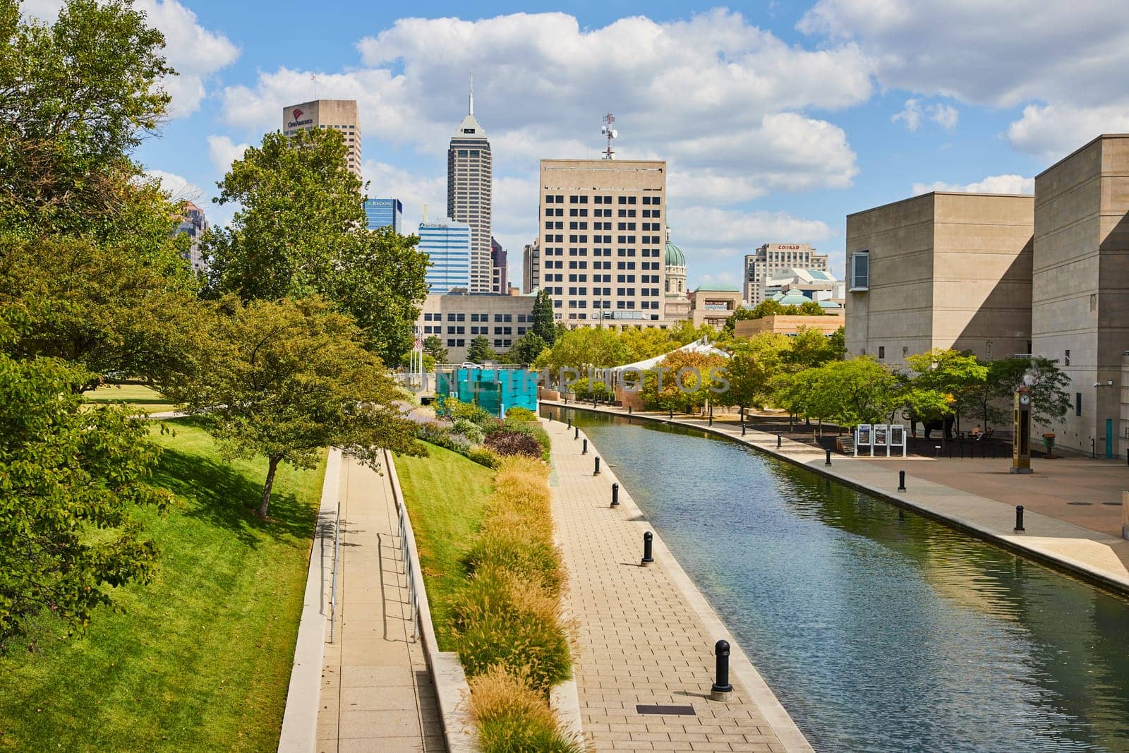 Serene Canal Walkway in Vibrant Indianapolis Cityscape, Showcasing a Harmonious Blend of Urban Progress and Green Spaces, 2023
