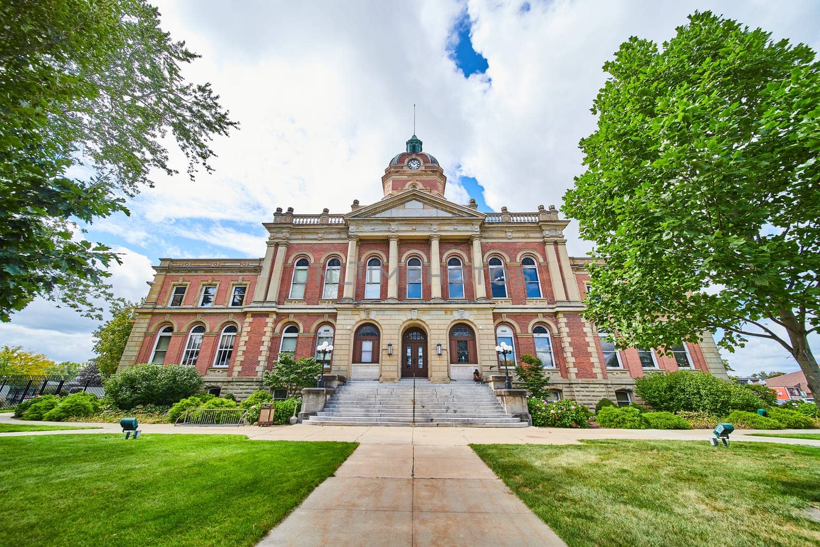 Image of Elkhart County courthouse on sunny summer day, front entrance law and order, Indiana