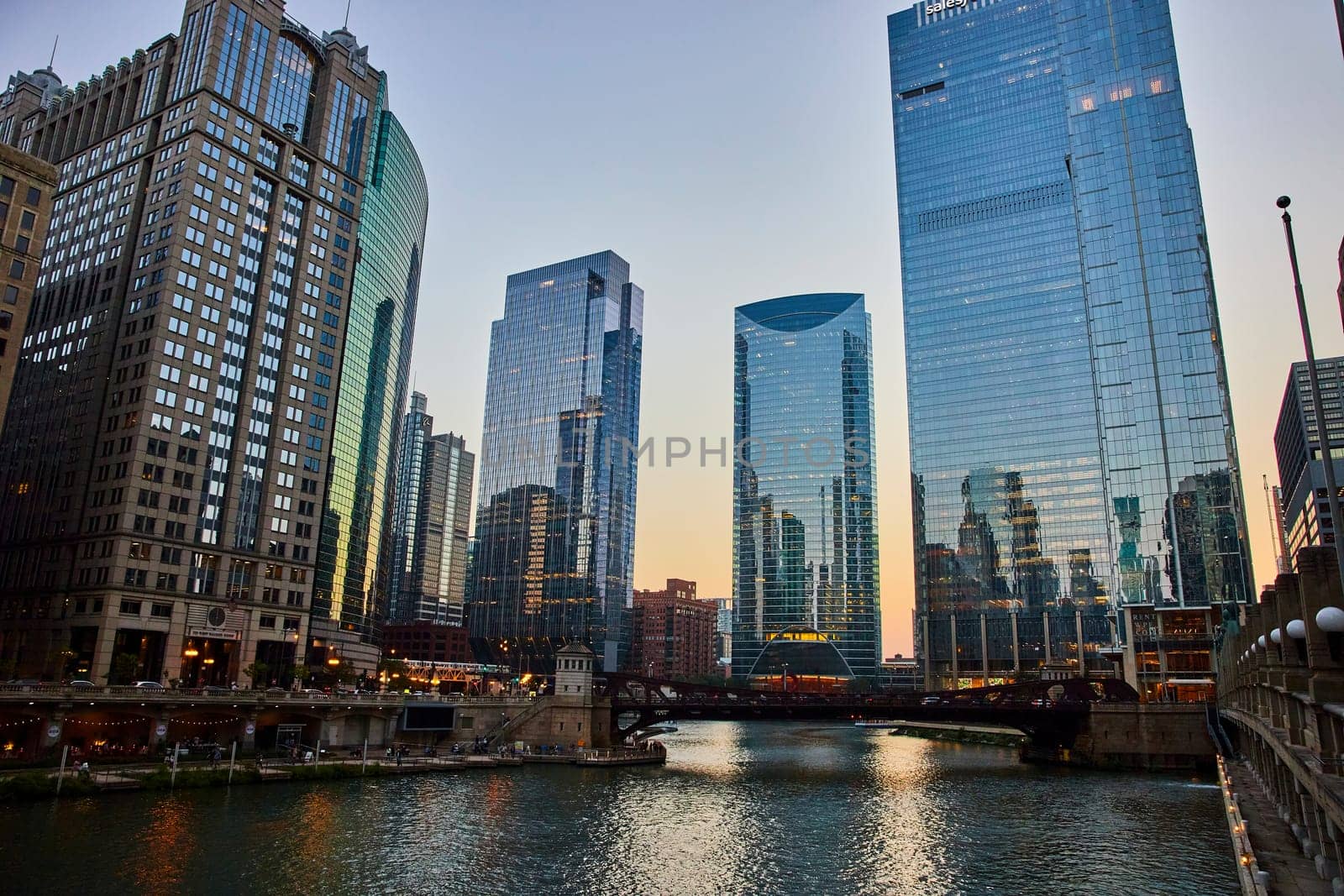 Gorgeous Chicago, IL canal at dawn with reflective blue windows of skyscrapers, tourism, travel by njproductions