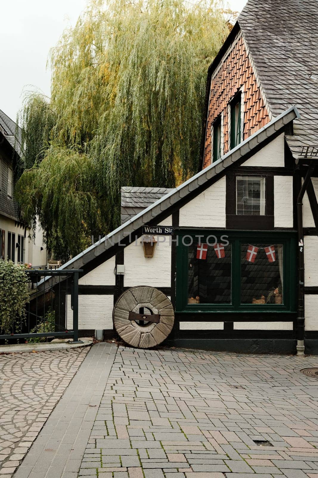 Vertical shot of the Old Worthmuehle at the Abzucht in autumn in Goslar, Germany