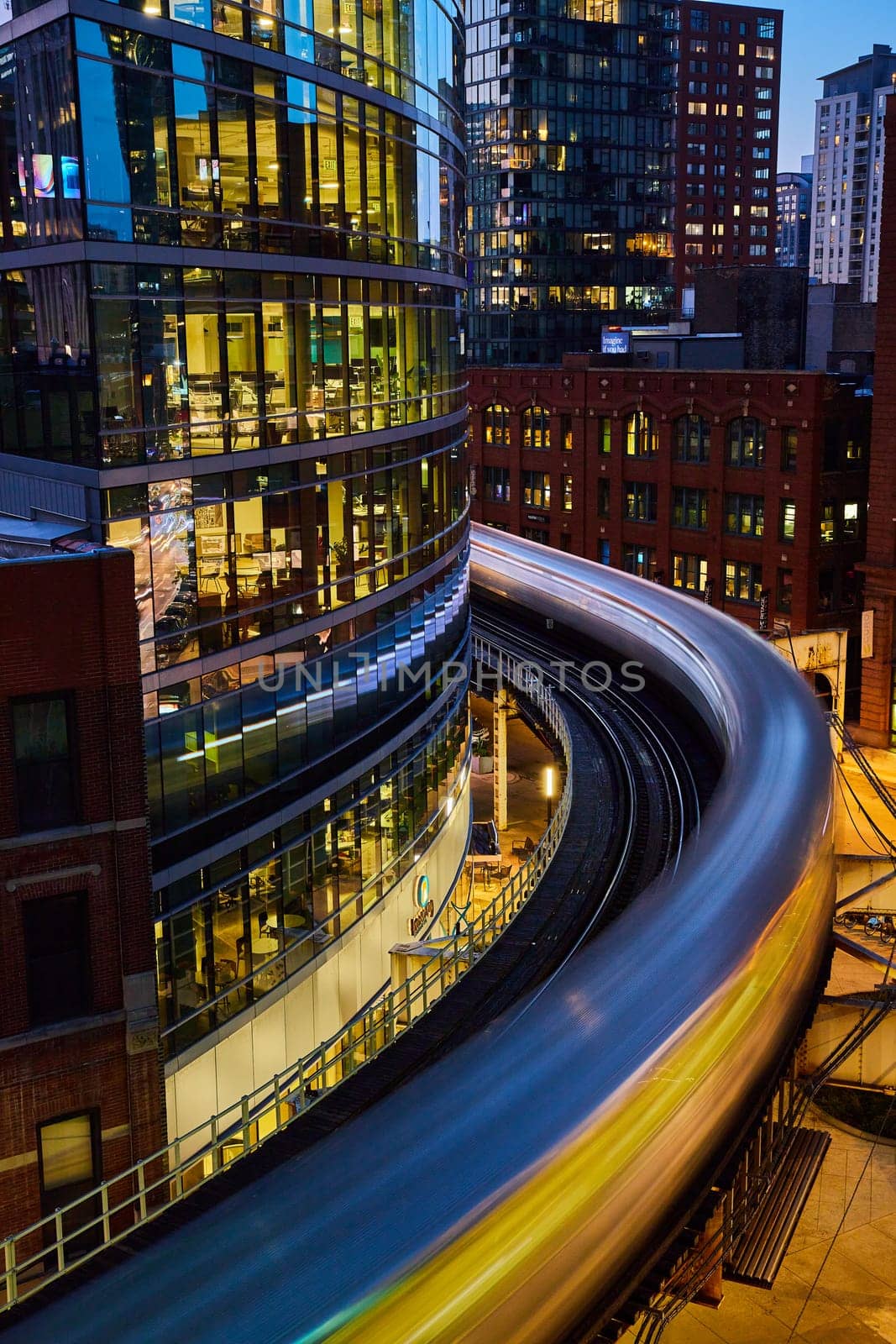 Blurred Train Motion and Urban Architecture at Dusk, Elevated View by njproductions
