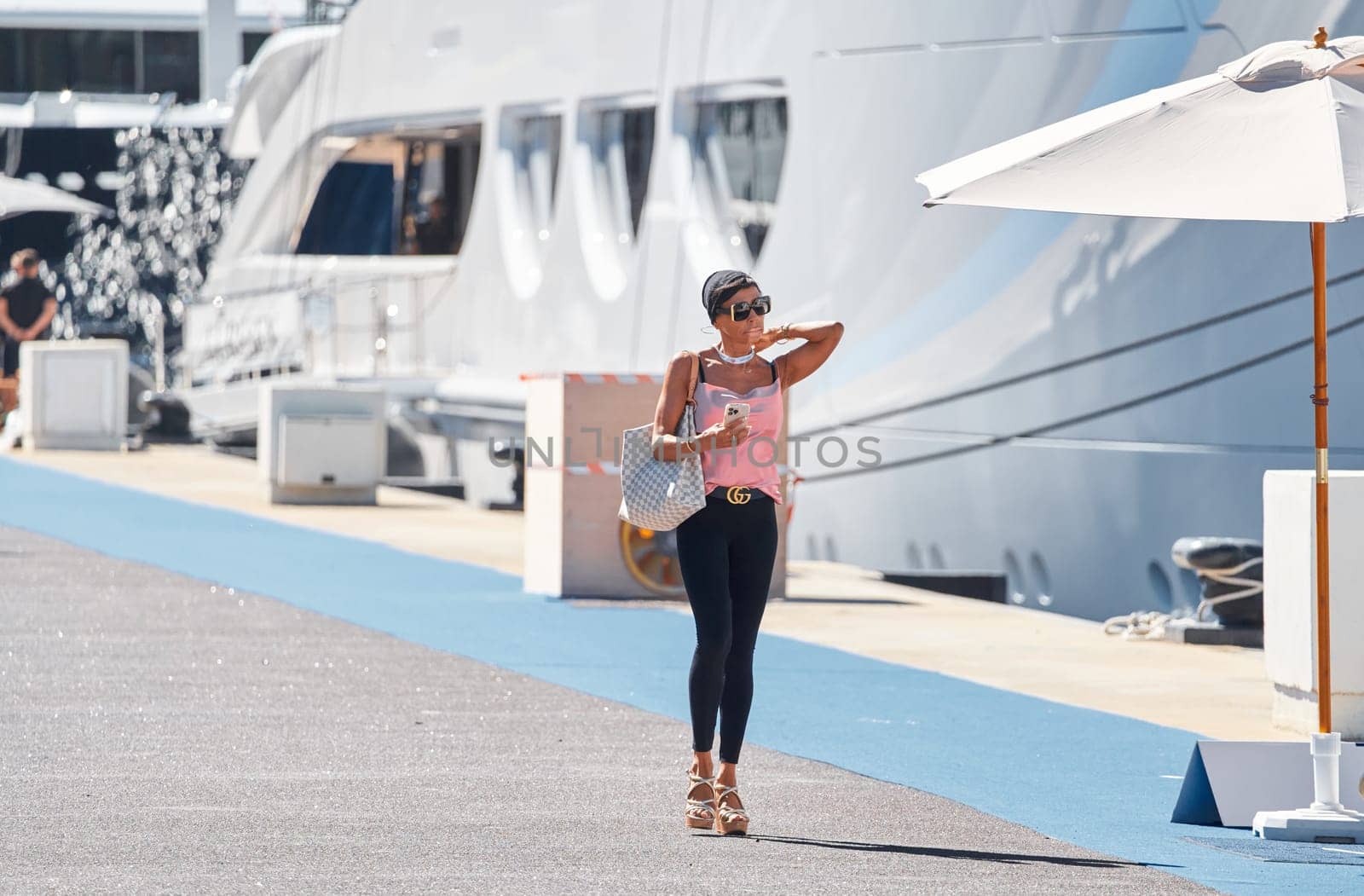 Monaco, Monte Carlo, 28 September 2022 - Invited wealthy clients inspect megayachts at the largest fair exhibition in the world yacht show MYS, port Hercules, yacht brokers, sunny weather by vladimirdrozdin