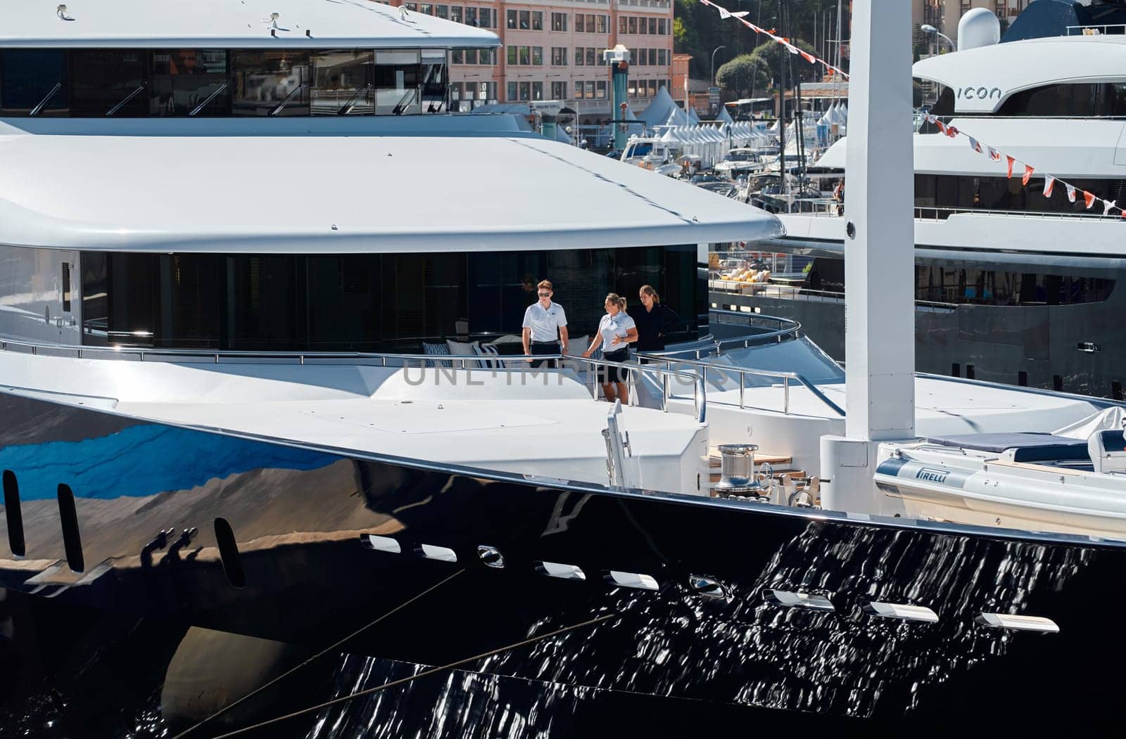 Monaco, Monte Carlo, 28 September 2022 - Invited wealthy clients inspect megayachts at the largest fair exhibition in the world yacht show MYS, port Hercules, yacht brokers, sunny weather by vladimirdrozdin