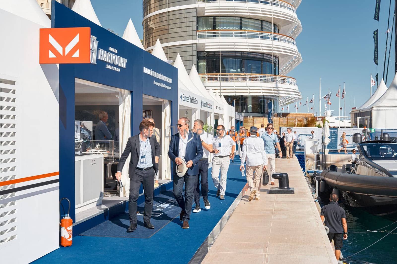 Monaco, Monte Carlo, 28 September 2022 - a lot of people, clients and yacht brokers look at the mega yachts presented, discuss the novelties of the boating industry at the famous motorboat exhibition. High quality photo