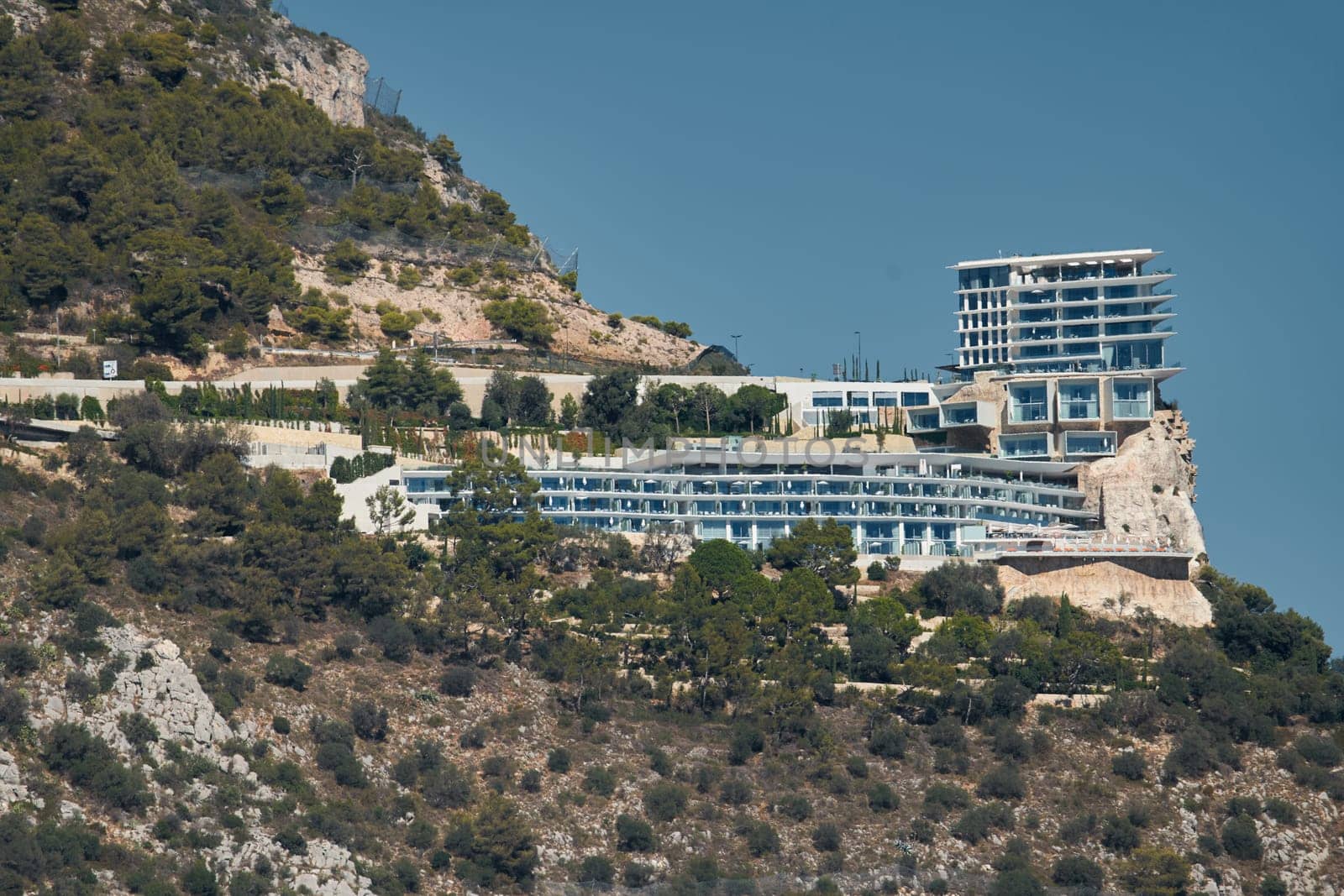 France, Roquebrune Cap Martin, 28 September 2022 - Famous five stars hotel on the rock The Maybourne Riviera at sunny day. High quality photo