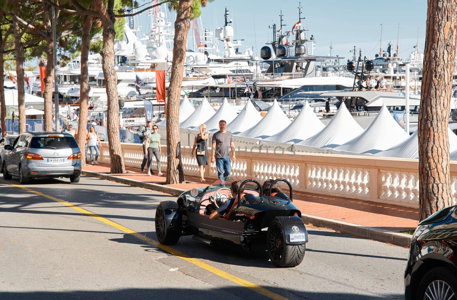Monaco, Monte Carlo, 28 September 2022 - Exclusive car on the famous motorboat exhibition in the principality, the most expensive boats for the richest people around the world, yacht brokers. High quality photo