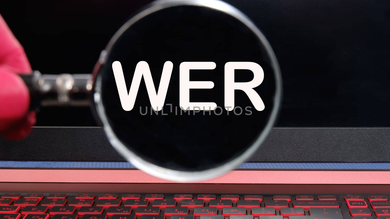 Who, German word for Who, (German: Wer) text on the monitor found through a magnifying glass
